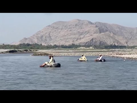 These Afghan teachers float to school in paddling rafts